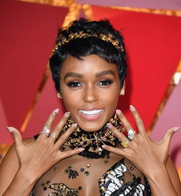 Closeup: Manicure and decorations of stars with a red carpet 